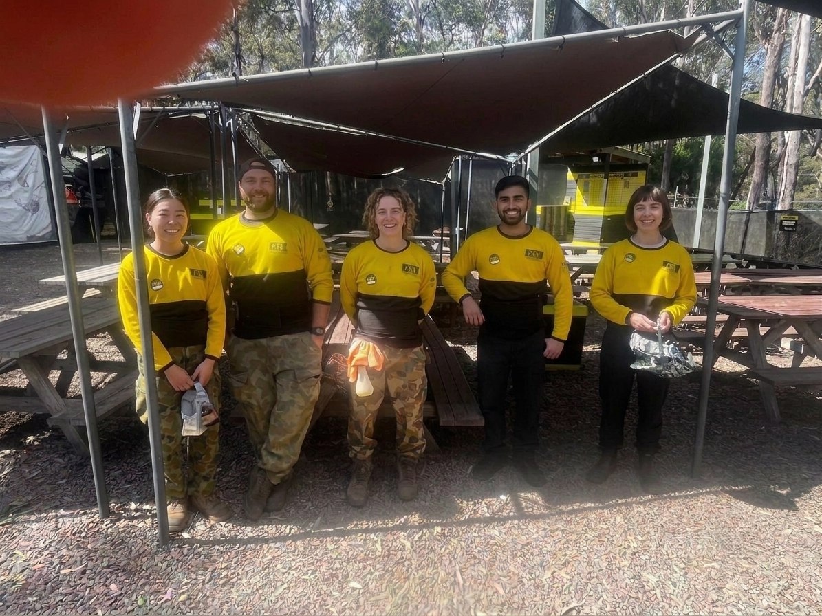 A smiling five-person Delta Force marshal group